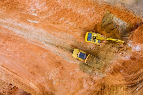 Preview: Backhoe working by digging soil at bucket teeth of backhoe digging soil and loads a dump truck with
