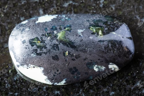 Preview: sample of polished teyskiy jade mineral on black