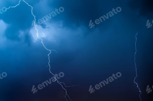 Preview: Lightning in the night sky. Thunderstorm over the city. Stormy clouds and rainy weather.