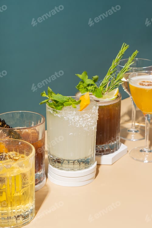 Preview: Composition with alcoholic cocktails on podium with ice on colored background.