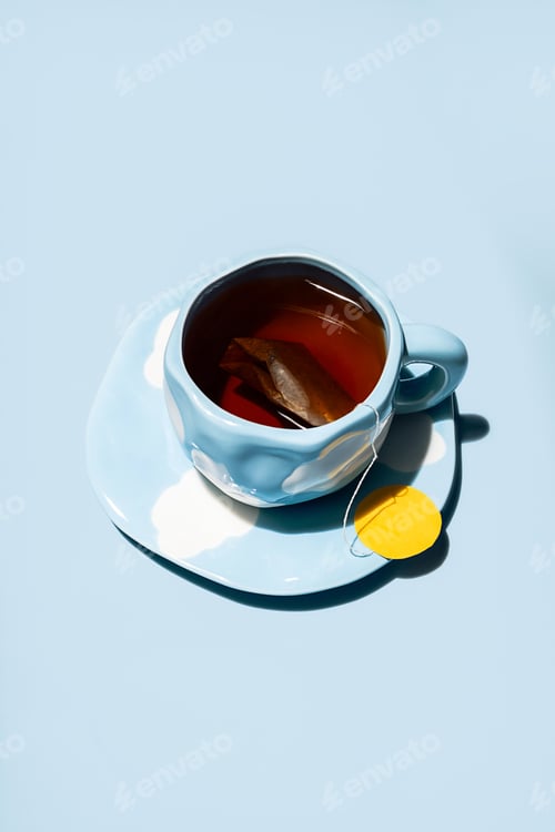 Preview: Tea cup with teabag. Teatime creative concepts.