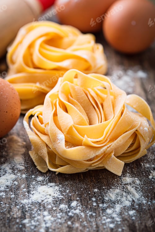 Preview: Raw pasta tagliatelle and eggs