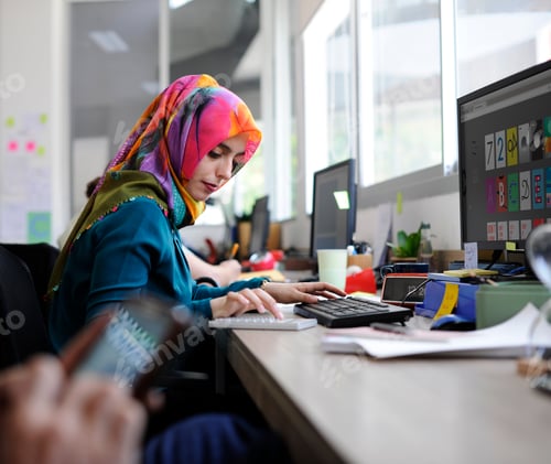 Preview: Muslim woman working at the office