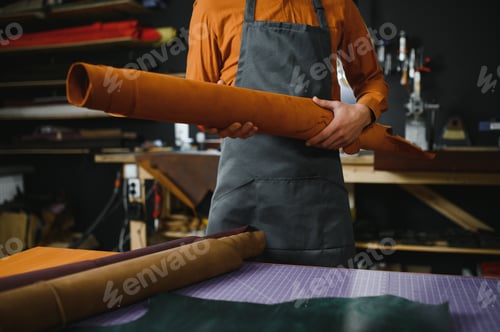 Preview: professional crafter checking the material at workplace