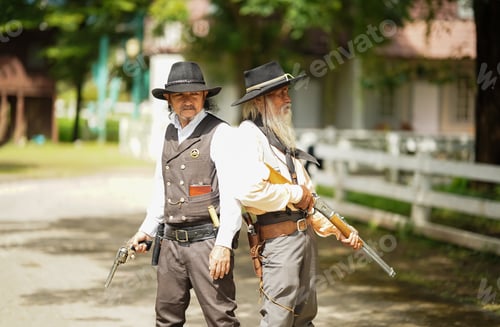 Preview: Brutal cowboy with revolver, gunfight on ranch, rural background.