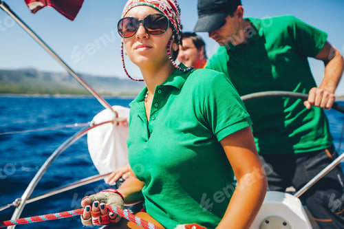 Preview: Young woman and men yachting near coast, Croatia