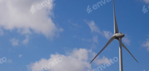 Preview: Closeup shot of a wind turbine on the background of heaven on a sunny day
