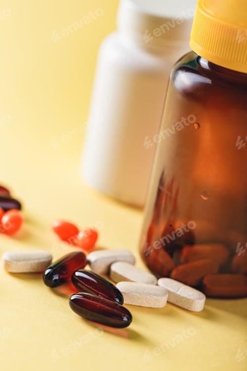 Preview: Bottle and Pills on yellow Background. Medicine Healthcare Pharmacy Concept. Coronavirus.