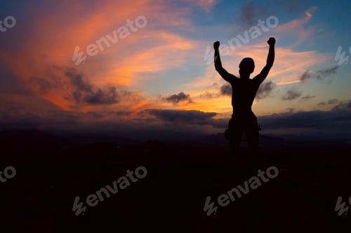 Preview: silhouettes. Hiker at the top of the mountain at sunset