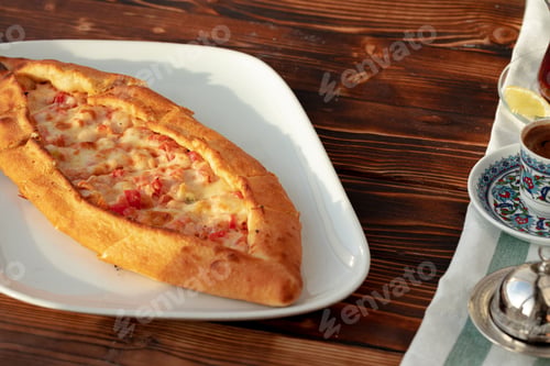 Preview: Close up of Turkish Pide bread on wooden table