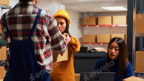 Preview: Group of workers checking merchandise in packages