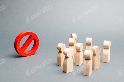 Preview: A crowd of people looks at the red sign NO