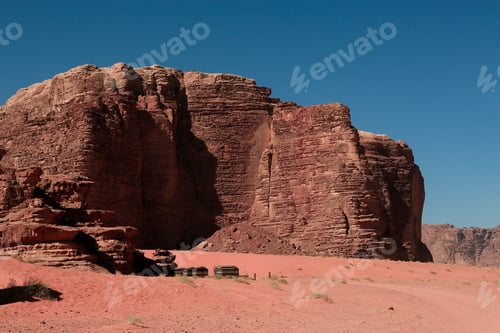 Preview: Wadi Rum Desert landscape in Jordan showcasing towering sandstone cliffs