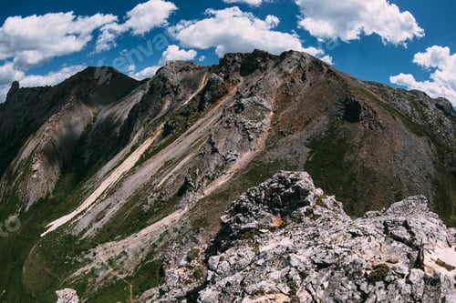 Preview: High altitude mountain landscape under blue sky