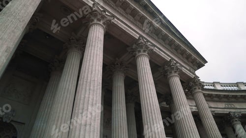 Preview: Colonnade with corinthian orders of ancient building. Action. Bottom view of beautiful white columns