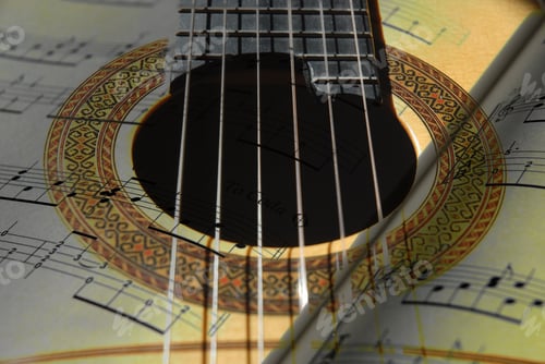 Preview: Classical acoustic guitar, detail of sound hole with a music score, close up