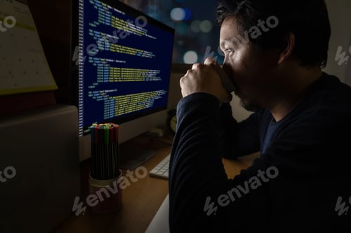Preview: Portrait of Asia Businessman sitting and working hard on the table with programming