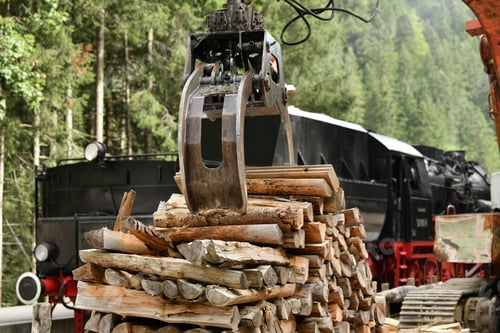 Preview: A scrap locomotive loading firewood into a vintage steam locomotive