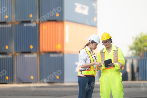 Preview: Portrait of Asian woman engineer and worker working with co-worker at overseas shipping container