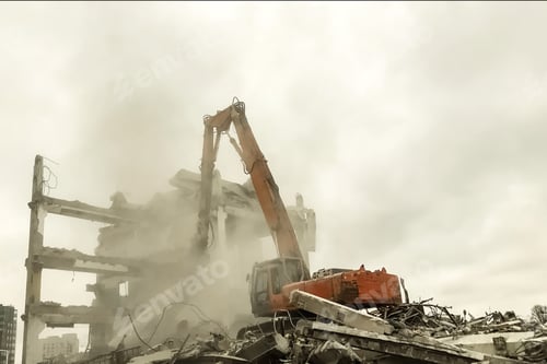 Preview: Hydraulic excavator surrounded with dust cloud taking down an old building