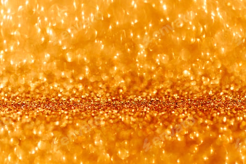 Preview: Festive abstract blurred glitter background golden color.