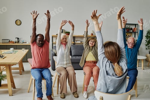 Preview: Senior people exercising together with instructor