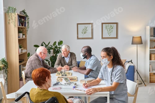 Preview: Doctors examining senior people in nursing home