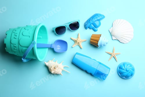 Preview: Flat lay composition with bright beach toys on color background. Space for text