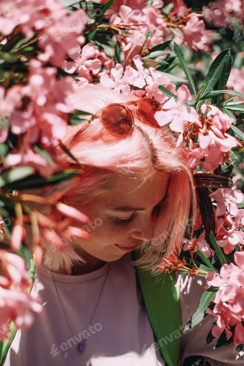 Preview: Beautiful young woman with pink hair
