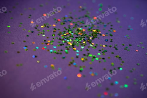 Preview: Colorful sparkling stars on violet background. Very peri color. Festive New Year concept