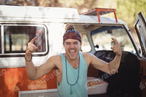 Preview: Portrait of happy man gesturing against van