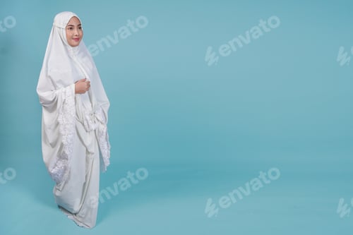 Preview: Woman in White Robe Against a Light Blue Background