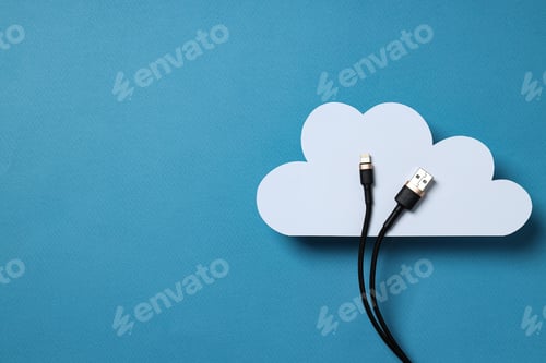 Preview: White, paper cloud with a black USB cable on a blue background, place for text