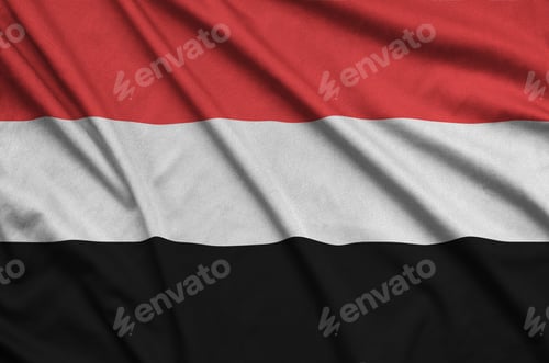 Preview: Yemen flag is depicted on a sports cloth fabric with many folds. Sport team waving banner
