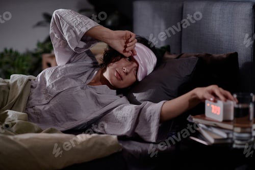 Preview: Woman Looking at Alarm
