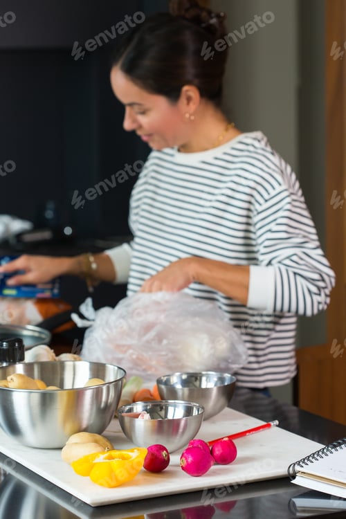Preview: Woman hands cutting, slicing vegetables on a cutting board
