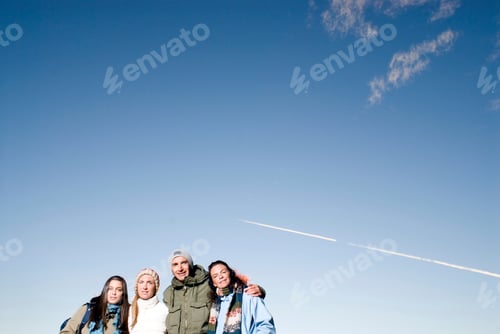 Preview: Group of people over blue sky