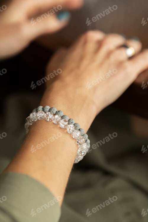 Preview: Woman's hand showing off her stacked style bracelet set.