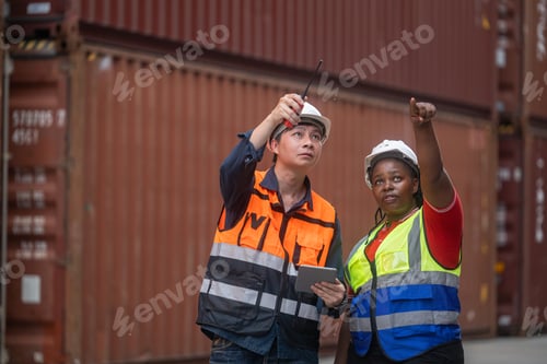 Preview: Logistics team assessing stacked shipping containers