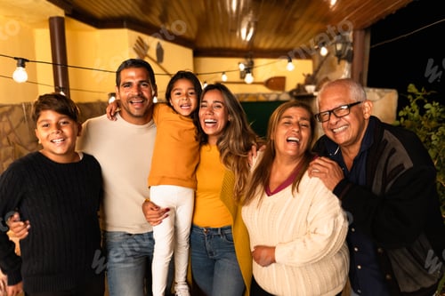 Preview: Happy Hispanic family enjoying holidays together at home