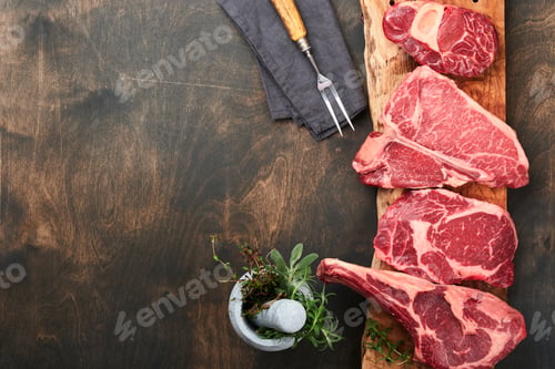 Preview: Raw prime steaks. Variety of fresh black angus prime meat steaks T-bone, New York, Ribeye, Striploin