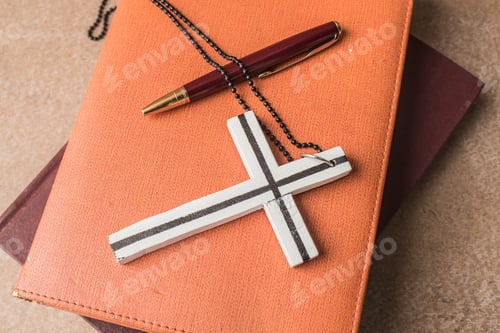 Preview: Cross on a books