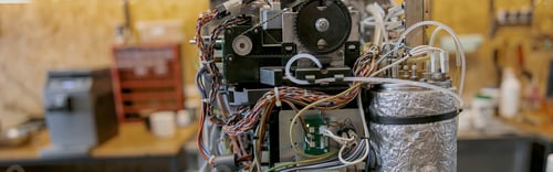 Preview: The interior of a defective espressomachine, ready to be repaired.