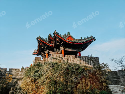 Preview: Low angle shot of a building surrounded by greenery in the Millennium city park in Kaifeng, China