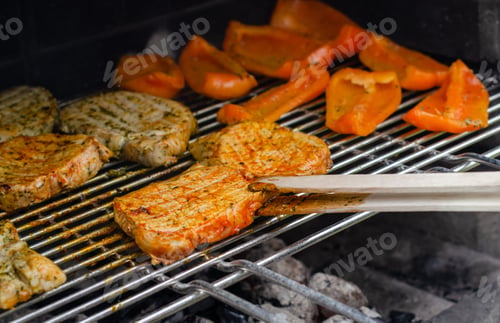 Preview: Pork marinated in herbs and yellow paprika on the grill, day off, vacation with the family.