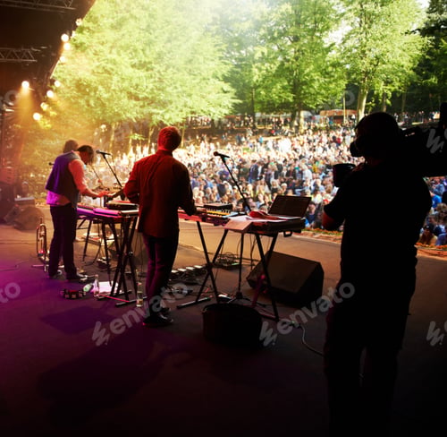 Preview: Ready to rock. Cropped shot of a musicians feet on stage at an outdoor music festival.
