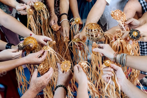 Preview: Different ages and nationalities females hands keeping their weaving craft together in a circle.