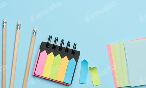 Preview: Multi-colored paper sticky notes on a blue background