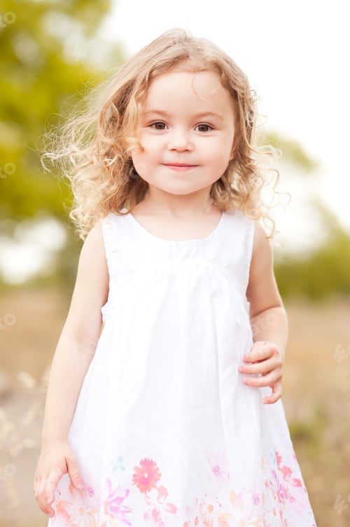 Preview: Cute little girl walking in meadow