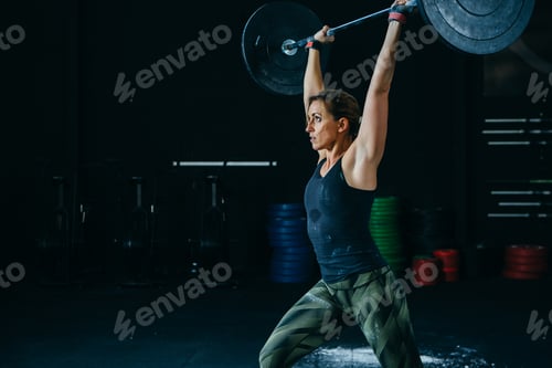 Preview: Woman does jerk with barbell